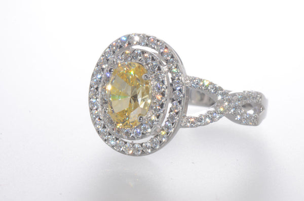 Sterling Silver Canary Yellow Oval Designer Cubic Zirconia Ring - Jewelryland.com