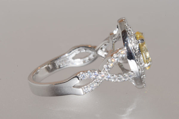 Sterling Silver Canary Yellow Oval Designer Cubic Zirconia Ring - Jewelryland.com