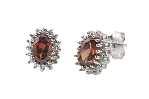 Sterling Silver Garnet & Diamond Stud Earrings Oval .03 ct, I-J, I2 - Jewelryland.com