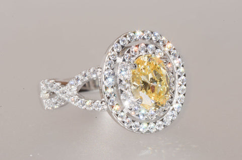 Sterling Silver Canary Yellow Oval Designer Cubic Zirconia Ring - Jewelryland.com