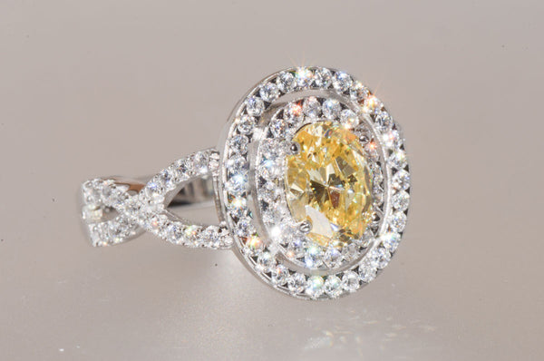 Sterling Silver Canary Yellow Oval Designer Cubic Zirconia Ring - Jewelryland.com