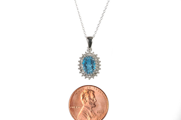 Sterling Silver Blue Topaz and Diamond Necklace (.01ct) Oval Pendant Necklace - Jewelryland.com
