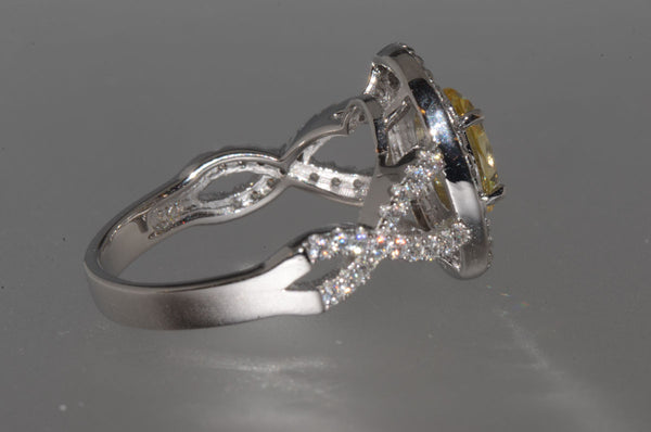 Sterling Silver Canary Yellow Oval Designer Cubic Zirconia Ring - Jewelryland.com