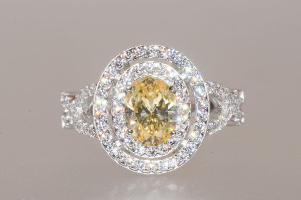 Sterling Silver Canary Yellow Oval Designer Cubic Zirconia Ring - Jewelryland.com