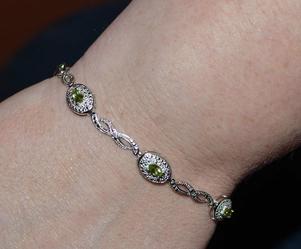 925 Sterling Silver Peridot & .01ct Diamond Bracelet 7.5" - Jewelryland.com
