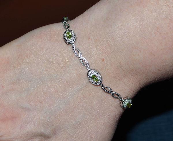 925 Sterling Silver Peridot & .01ct Diamond Bracelet 7.5" - Jewelryland.com