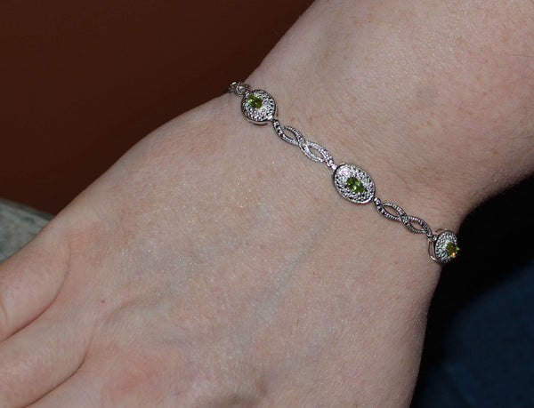 925 Sterling Silver Peridot & .01ct Diamond Bracelet 7.5" - Jewelryland.com